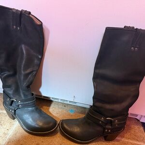 Frye knee-high leather harness boots.